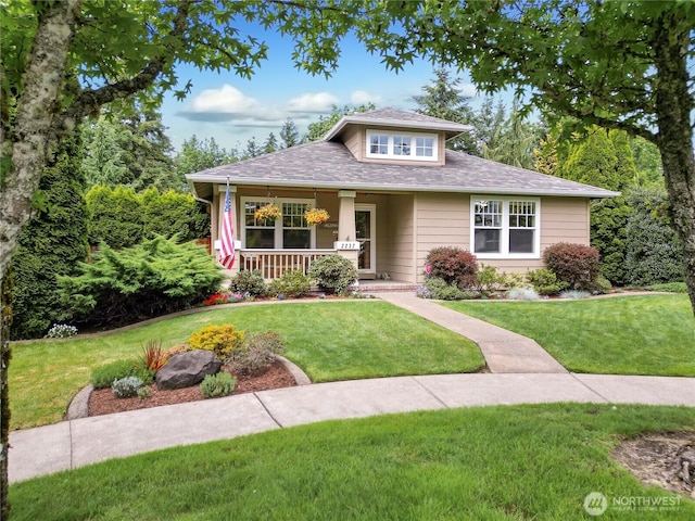 2237 Mcdonald Ave, Dupont, WA 98327 - view of front of property with a front lawn, covered porch, and a shingled roof