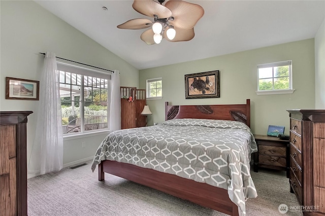 2237 Mcdonald Ave, Dupont, WA 98327 - carpeted bedroom with multiple windows, lofted ceiling, and ceiling fan