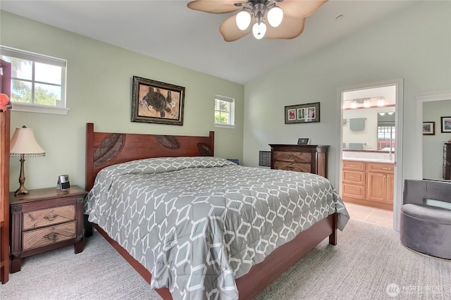 2237 Mcdonald Ave, Dupont, WA 98327 - bedroom featuring vaulted ceiling, light carpet, ensuite bathroom, and a ceiling fan