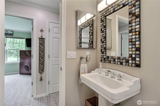 2237 Mcdonald Ave, Dupont, WA 98327 - bathroom featuring a sink and crown molding