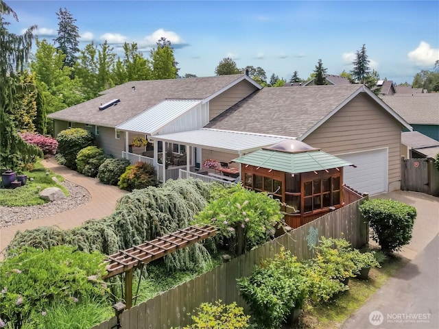 2237 Mcdonald Ave, Dupont, WA 98327 - view of front of home featuring roof with shingles, an attached garage, a gazebo, and concrete driveway