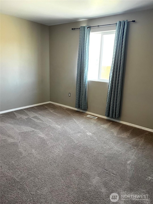 1042 S Lakeland Dr, Moses Lake, WA 98837 - spare room with carpet and baseboards