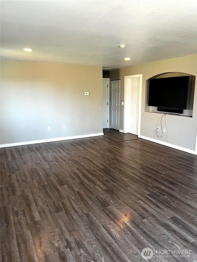1042 S Lakeland Dr, Moses Lake, WA 98837 - unfurnished living room with dark wood-style floors and recessed lighting