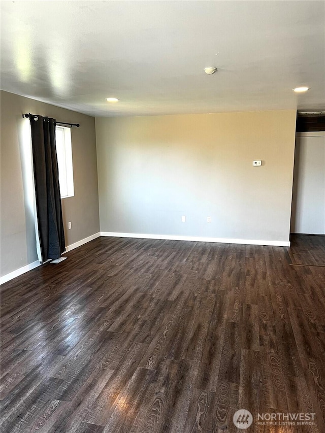 1042 S Lakeland Dr, Moses Lake, WA 98837 - unfurnished room featuring dark wood-style flooring and baseboards