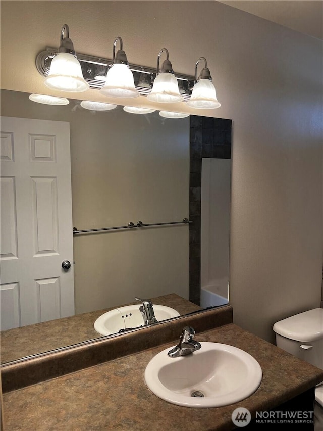 1042 S Lakeland Dr, Moses Lake, WA 98837 - bathroom with vanity and toilet