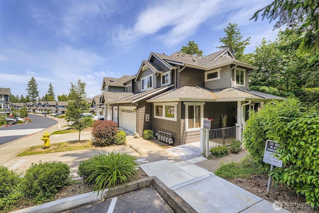 5589 Lakemont Blvd SE Unit 1703, Bellevue, WA 98006 - view of front of home featuring a shingled roof and a garage