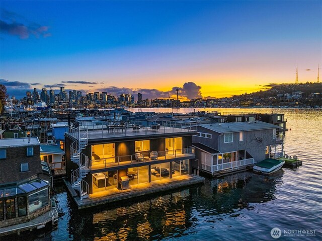 2241 Fairview Ave E Unit B, Seattle, WA 98102 - back of house at dusk featuring a water view