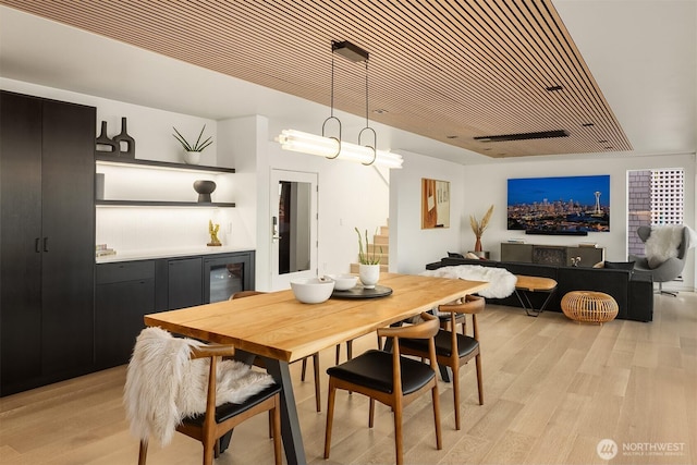 2241 Fairview Ave E Unit B, Seattle, WA 98102 - dining space featuring light wood-style flooring, wine cooler, and a dry bar