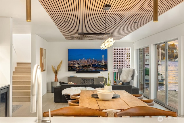 2241 Fairview Ave E Unit B, Seattle, WA 98102 - living area featuring stairs, wood finished floors, and beverage cooler