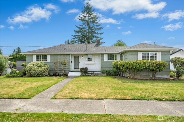 1037 Harding St, Enumclaw, WA 98022 - view of front of home featuring a front yard and a chimney