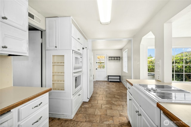 1037 Harding St, Enumclaw, WA 98022 - kitchen with white appliances, light countertops, and white cabinets