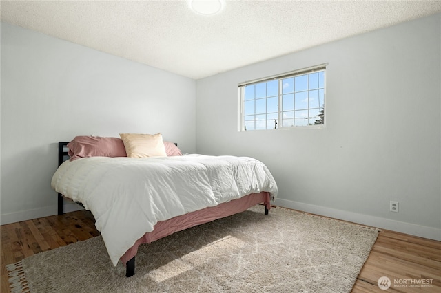 1037 Harding St, Enumclaw, WA 98022 - bedroom with wood finished floors and a textured ceiling