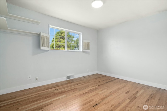 1037 Harding St, Enumclaw, WA 98022 - spare room featuring wood finished floors and baseboards