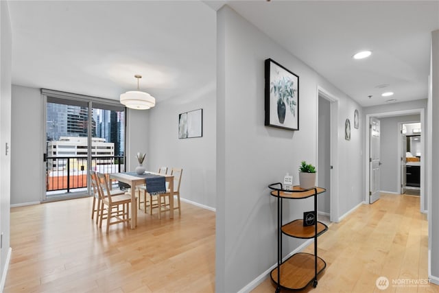 177 NE 107th Ave Unit 1601, Bellevue, WA 98004 - dining area featuring light wood-type flooring and recessed lighting