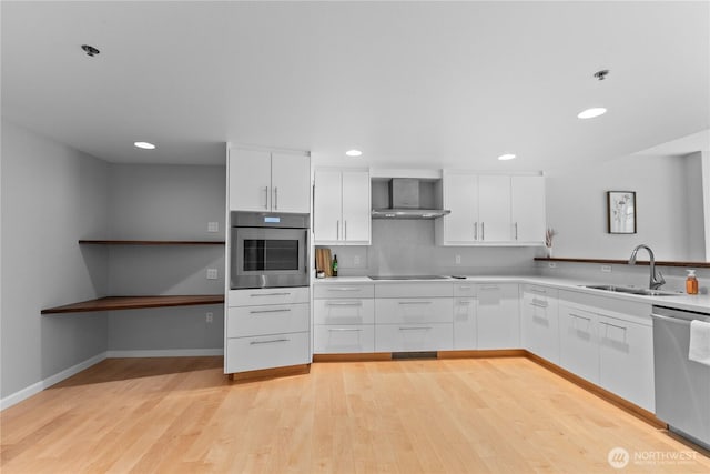 177 NE 107th Ave Unit 1601, Bellevue, WA 98004 - kitchen featuring appliances with stainless steel finishes, white cabinets, light wood finished floors, recessed lighting, and light countertops