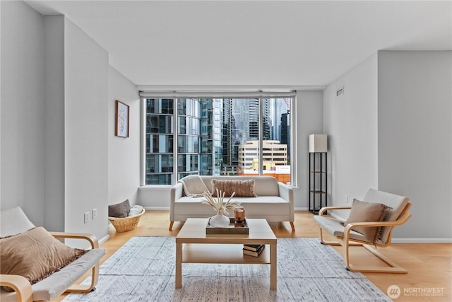 177 NE 107th Ave Unit 1601, Bellevue, WA 98004 - living room featuring wood finished floors and baseboards