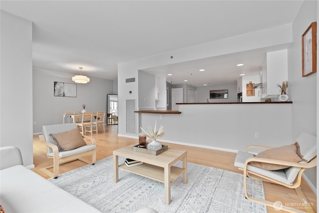 177 NE 107th Ave Unit 1601, Bellevue, WA 98004 - living room featuring wood finished floors and recessed lighting