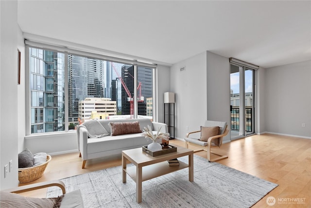 177 NE 107th Ave Unit 1601, Bellevue, WA 98004 - living area featuring wood finished floors and plenty of natural light