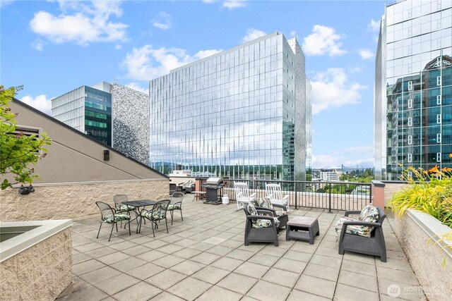 177 NE 107th Ave Unit 1601, Bellevue, WA 98004 - view of patio / terrace featuring a view of city, an outdoor hangout area, and outdoor dining area