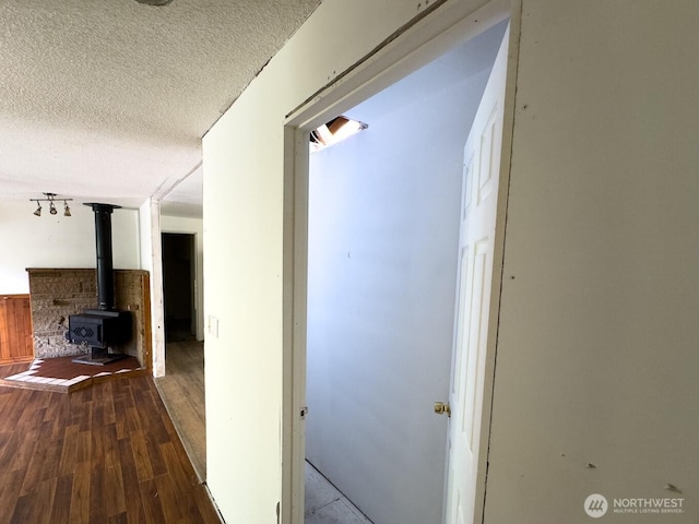 6420 NE Nelson St, Suquamish, WA 98392 - hallway with wood finished floors and a textured ceiling