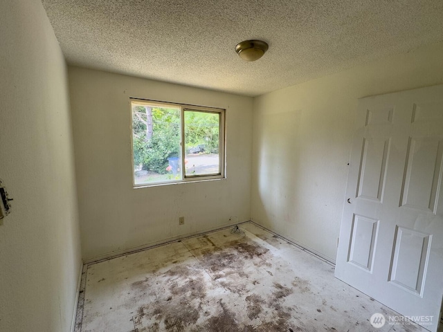 6420 NE Nelson St, Suquamish, WA 98392 - unfurnished room with a textured ceiling