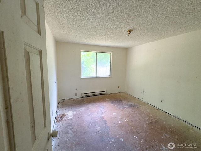 6420 NE Nelson St, Suquamish, WA 98392 - unfurnished room with a baseboard radiator and a textured ceiling