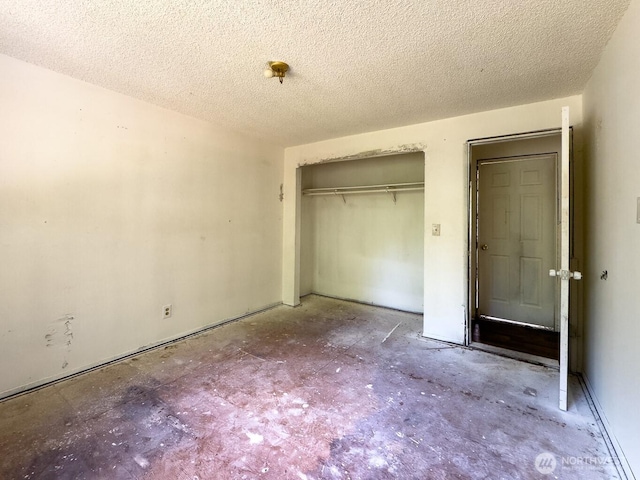 6420 NE Nelson St, Suquamish, WA 98392 - unfurnished bedroom featuring a closet and a textured ceiling