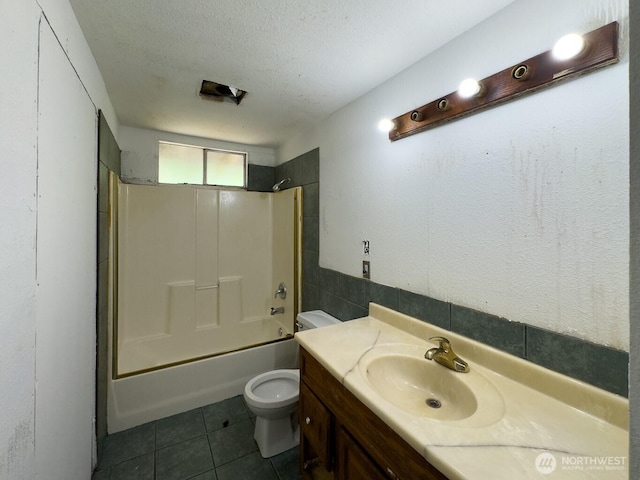 6420 NE Nelson St, Suquamish, WA 98392 - bathroom featuring shower / bath combination, vanity, tile patterned flooring, and a textured ceiling