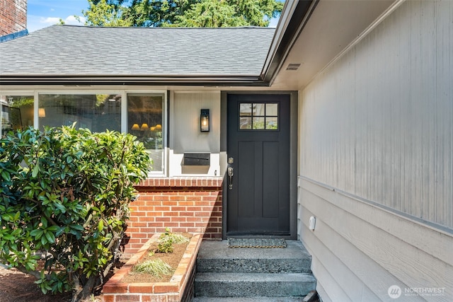 7006 20th Ave NE, Seattle, WA 98115 - doorway to property featuring brick siding and roof with shingles