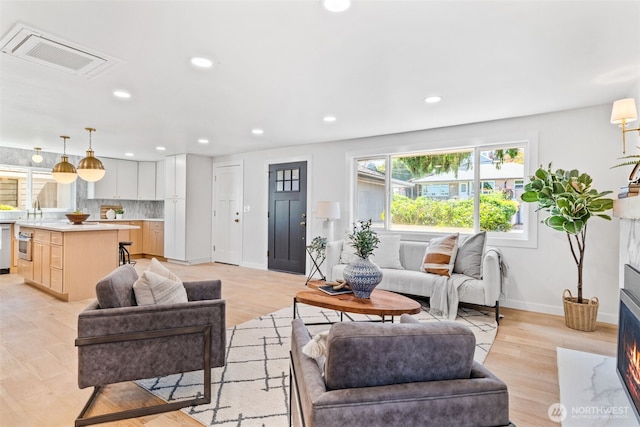 7006 20th Ave NE, Seattle, WA 98115 - living room with recessed lighting and light wood-style flooring