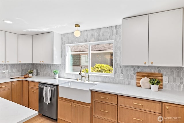7006 20th Ave NE, Seattle, WA 98115 - kitchen with dishwasher, light countertops, tasteful backsplash, white cabinetry, and light wood-style flooring