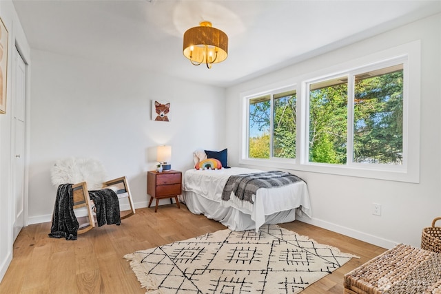 7006 20th Ave NE, Seattle, WA 98115 - bedroom featuring baseboards and light wood finished floors