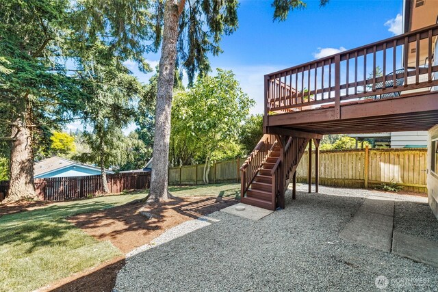 7006 20th Ave NE, Seattle, WA 98115 - fenced backyard featuring a wooden deck and a patio