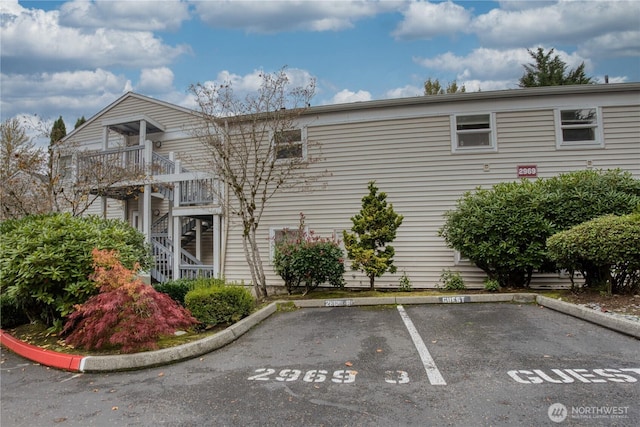 2969 142nd Pl SE # 8, Bellevue, WA 98007 - view of property with uncovered parking and stairs
