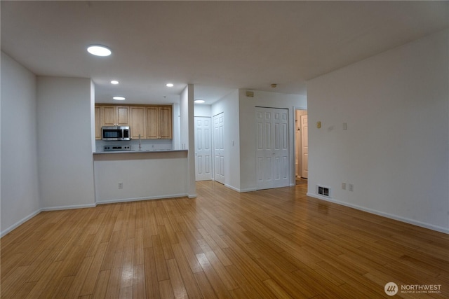 2969 142nd Pl SE # 8, Bellevue, WA 98007 - unfurnished living room featuring light wood-style floors and recessed lighting