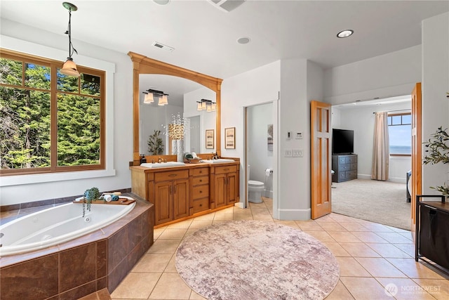 6730 Forest Ridge Dr, Wenatchee, WA 98801 - full bathroom featuring double vanity, a jetted tub, tile patterned floors, and recessed lighting
