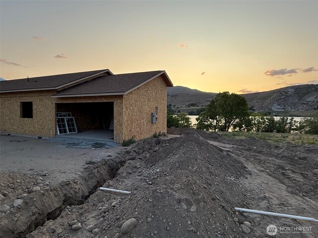 30 Chambers Rd, Brewster, WA 98812 - view of side of home with an attached garage and a mountain view