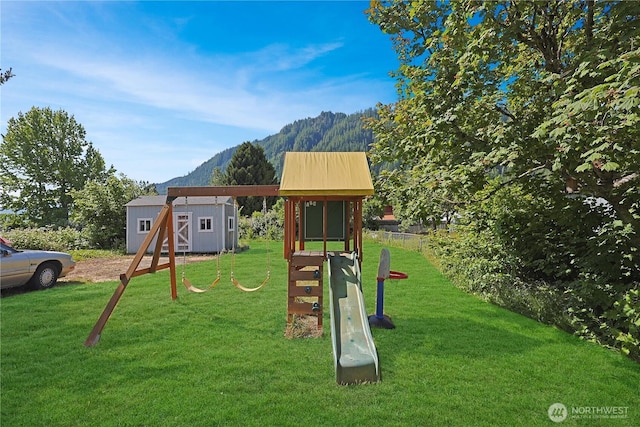 373 Adams Ave, Morton, WA 98356 - view of playground with a mountain view, a storage shed, and a yard