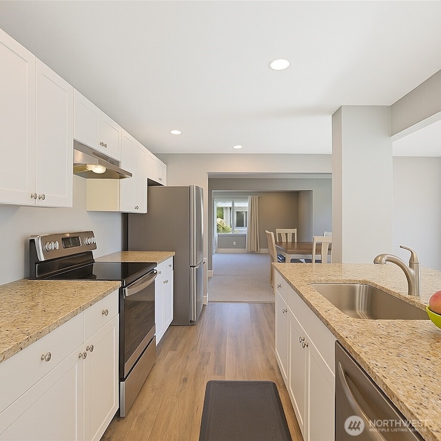 373 Adams Ave, Morton, WA 98356 - kitchen with appliances with stainless steel finishes, under cabinet range hood, white cabinets, light wood-style floors, and recessed lighting