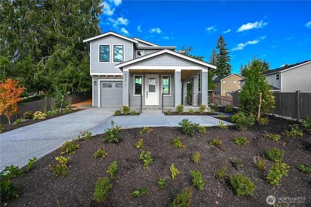 26517 NE 147th Pl Unit Sr 13, Duvall, WA 98019 - view of front facade with a porch, an attached garage, and concrete driveway