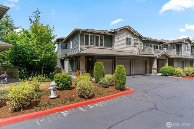 15325 SE 155th Pl Unit N-2, Renton, WA 98058 - view of front facade with an attached garage, driveway, and a balcony