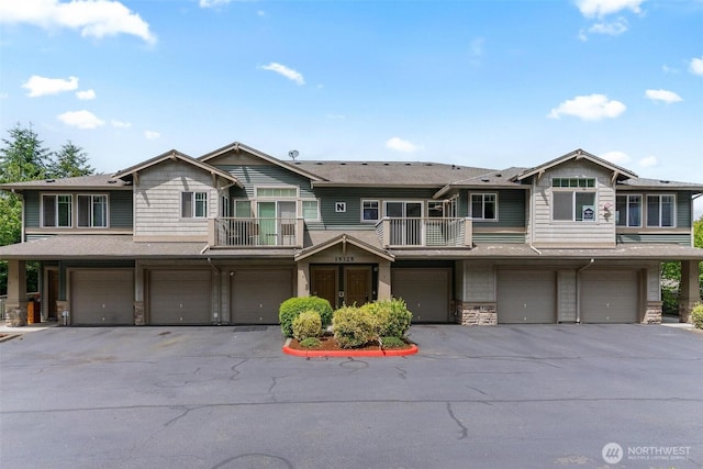 15325 SE 155th Pl Unit N-2, Renton, WA 98058 - multi unit property with a balcony, a garage, stone siding, and driveway