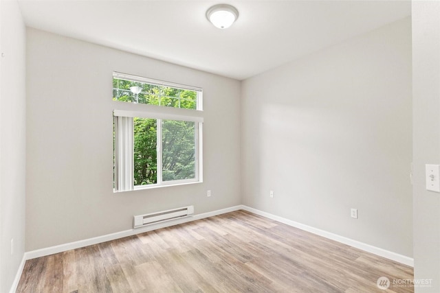 15325 SE 155th Pl Unit N-2, Renton, WA 98058 - empty room featuring a baseboard radiator and light wood-style flooring
