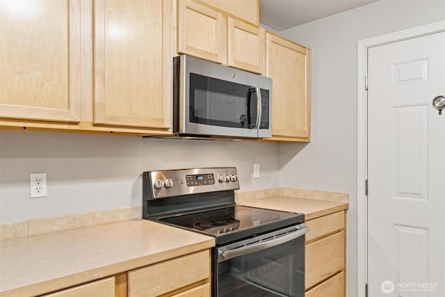 15325 SE 155th Pl Unit N-2, Renton, WA 98058 - kitchen with stainless steel appliances, light brown cabinetry, and light countertops