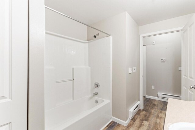 15325 SE 155th Pl Unit N-2, Renton, WA 98058 - full bathroom with wood finished floors, baseboard heating, shower / tub combination, and vanity