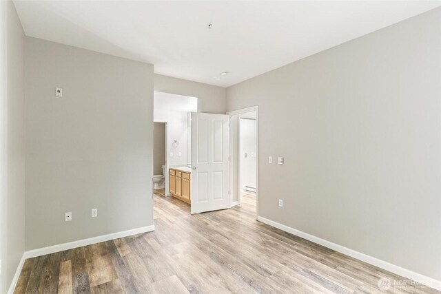 15325 SE 155th Pl Unit N-2, Renton, WA 98058 - empty room featuring light wood finished floors and baseboards