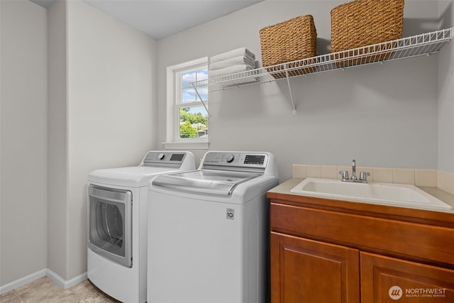 8122 NE 189th Pl, Kenmore, WA 98028 - laundry area featuring washing machine and clothes dryer, cabinet space, and light tile patterned flooring