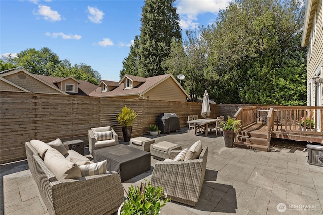 8122 NE 189th Pl, Kenmore, WA 98028 - fenced backyard featuring an outdoor living space, outdoor dining space, area for grilling, a patio area, and a deck