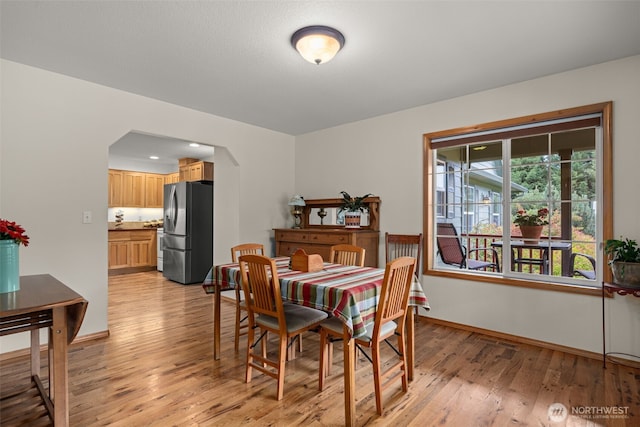 25901 NE 412th Cir, Amboy, WA 98601 - dining room featuring light wood finished floors and arched walkways