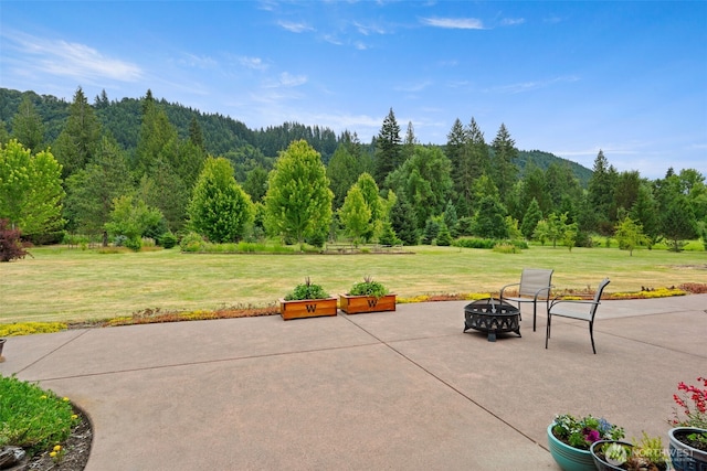25901 NE 412th Cir, Amboy, WA 98601 - view of patio / terrace featuring an outdoor fire pit and a forest view